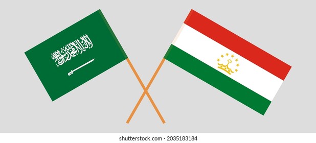 Crossed flags of the Kingdom of Saudi Arabia and Tajikistan. Official colors. Correct proportion