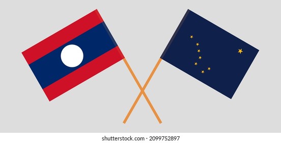 Crossed flags of Laos and the State of Alaska. Official colors. Correct proportion. Vector illustration
