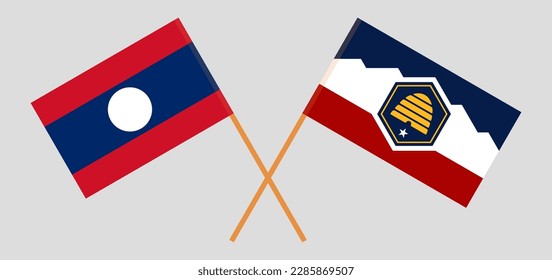 Crossed flags of Laos and The State of Utah. Official colors. Correct proportion. Vector illustration