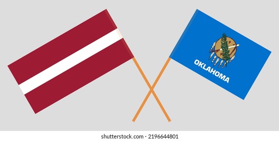 Crossed flags of Latvia and The State of Oklahoma. Official colors. Correct proportion. Vector illustration
