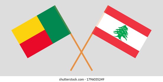Crossed flags of Lebanon and Benin. Official colors. Correct proportion. Vector illustration
