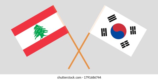 Crossed flags of Lebanon and South Korea