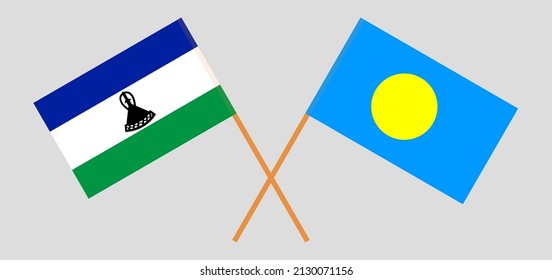 Crossed flags of Lesotho and Palau. Official colors. Correct proportion. Vector illustration
