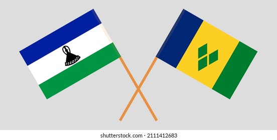 Crossed flags of Lesotho and Saint Vincent and the Grenadines. Official colors. Correct proportion. Vector illustration