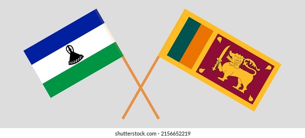 Gekreuzte Flaggen von Lesotho und Sri Lanka. Offizielle Farben. Richtiger Anteil. Vektorgrafik
