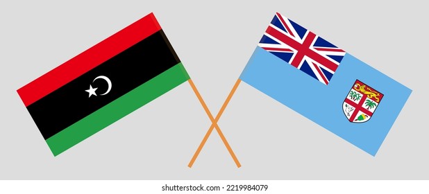 Crossed flags of Libya and Fiji. Official colors. Correct proportion. Vector illustration

