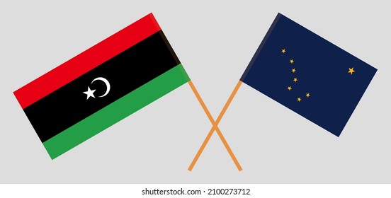 Crossed flags of Libya and the State of Alaska. Official colors. Correct proportion. Vector illustration
