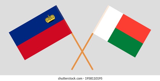 Crossed flags of Liechtenstein and Madagascar. Official colors. Correct proportion