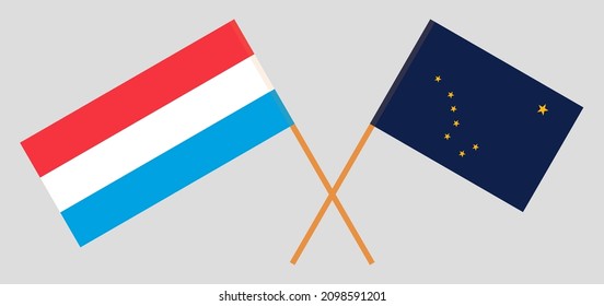 Crossed flags of Luxembourg and the State of Alaska. Official colors. Correct proportion. Vector illustration
