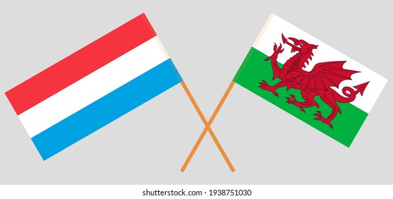 Crossed flags of Luxembourg and Wales. Official colors. Correct proportion