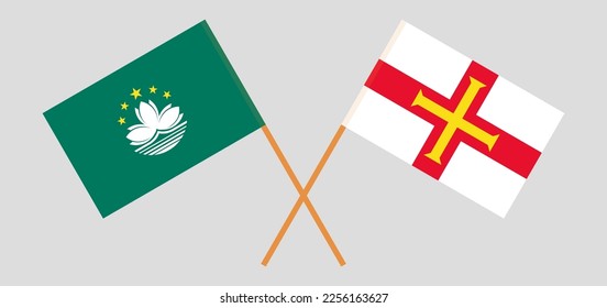 Crossed flags of Macau and Bailiwick of Guernsey. Official colors. Correct proportion. Vector illustration

