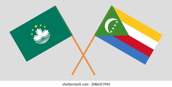 Überquerte Flaggen von Macau und den Komoren. Offizielle Farben. Richtiger Anteil. Vektorgrafik
