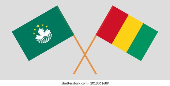 Banderas cruzadas de Macao y Guinea. Colores oficiales. Proporción correcta
