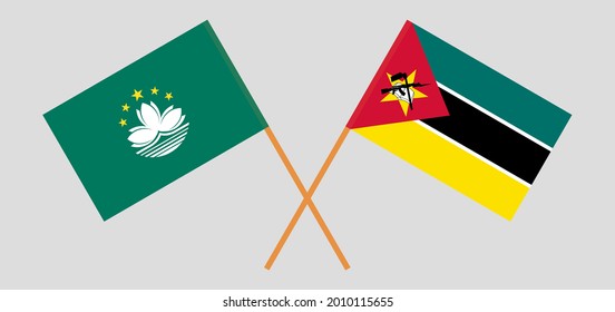 Crossed flags of Macau and Mozambique. Official colors. Correct proportion