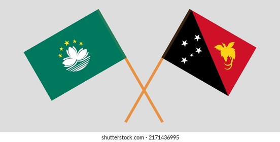 Crossed flags of Macau and Papua New Guinea. Official colors. Correct proportion. Vector illustration