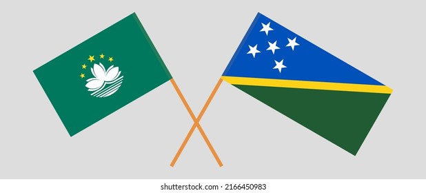 Crossed flags of Macau and Solomon Islands. Official colors. Correct proportion. Vector illustration
