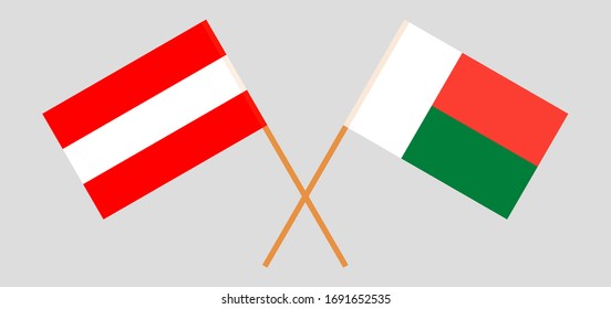 Crossed flags of Madagascar and Austria