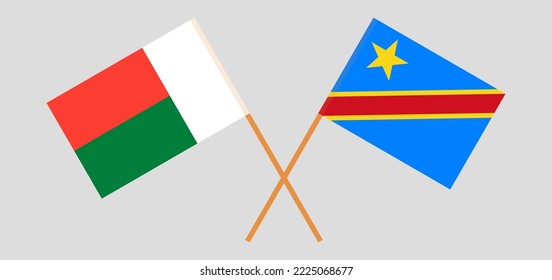 Banderas cruzadas de Madagascar y la República Democrática del Congo. Colores oficiales. Proporción correcta. Ilustración del vector
