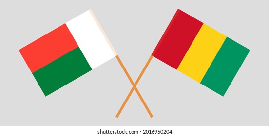 Crossed flags of Madagascar and Guinea. Official colors. Correct proportion
