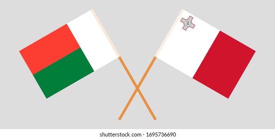 Crossed flags of Madagascar and Malta. Official colors. Correct proportion. Vector illustration
