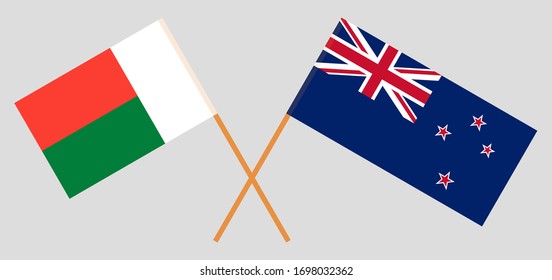Crossed flags of Madagascar and New Zealand. Official colors. Correct proportion. Vector illustration
