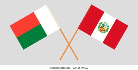 Überquerte Flaggen von Madagaskar und Peru. Offizielle Farben. Richtiger Anteil. Vektorgrafik
