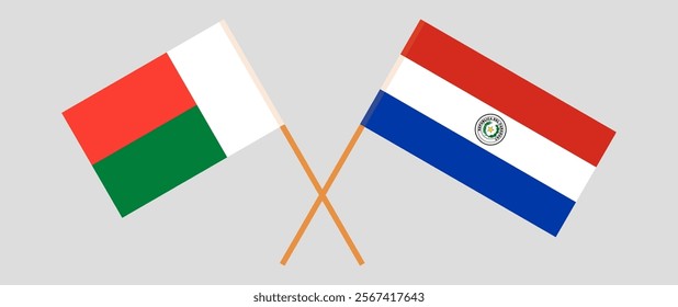 Crossed flags of Madagascar and Republic of Paraguay. Official colors. Correct proportion. Vector illustration.
