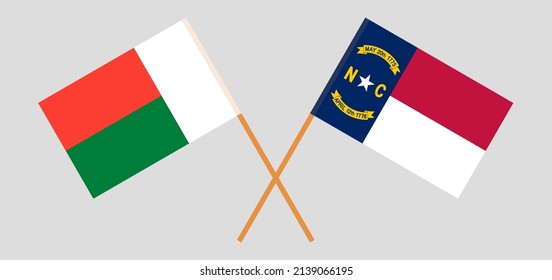 Crossed flags of Madagascar and The State of North Carolina. Official colors. Correct proportion. Vector illustration
