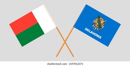 Crossed flags of Madagascar and The State of Oklahoma. Official colors. Correct proportion. Vector illustration

