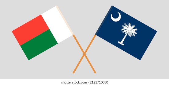 Crossed flags of Madagascar and The State of South Carolina. Official colors. Correct proportion. Vector illustration
