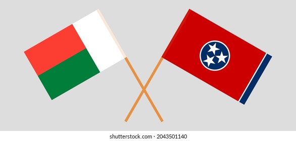 Crossed flags of Madagascar and the State of Tennessee. Official colors. Correct proportion