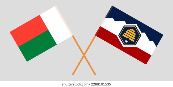 Crossed flags of Madagascar and The State of Utah. Official colors. Correct proportion. Vector illustration
