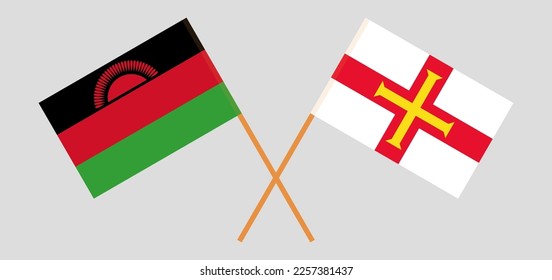 Crossed flags of Malawi and Bailiwick of Guernsey. Official colors. Correct proportion. Vector illustration
