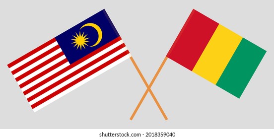 Banderas cruzadas de Malasia y Guinea. Colores oficiales. Proporción correcta
