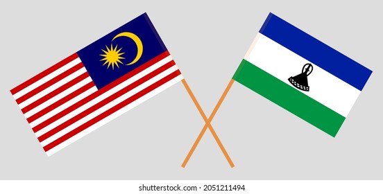 Crossed flags of Malaysia and Kingdom of Lesotho. Official colors. Correct proportion