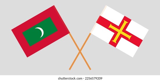 Crossed flags of Maldives and Bailiwick of Guernsey. Official colors. Correct proportion. Vector illustration
