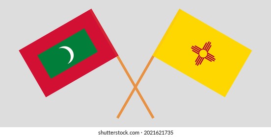 Crossed flags of Maldives and the State of New Mexico. Official colors. Correct proportion