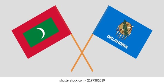 Crossed flags of Maldives and The State of Oklahoma. Official colors. Correct proportion. Vector illustration
