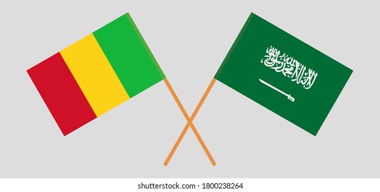 Crossed flags of Mali and the Kingdom of Saudi Arabia