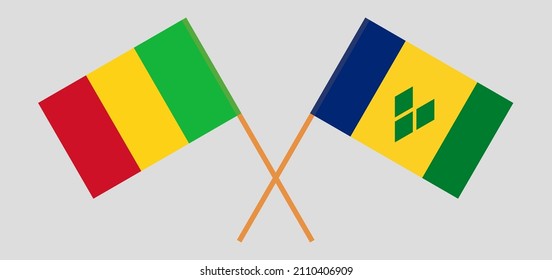 Überquerte Flaggen von Mali und St. Vincent und die Grenadinen. Offizielle Farben. Richtiger Anteil. Vektorgrafik
