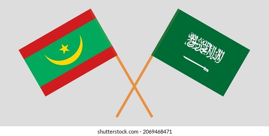 Crossed flags of Mauritania and the Kingdom of Saudi Arabia. Official colors. Correct proportion