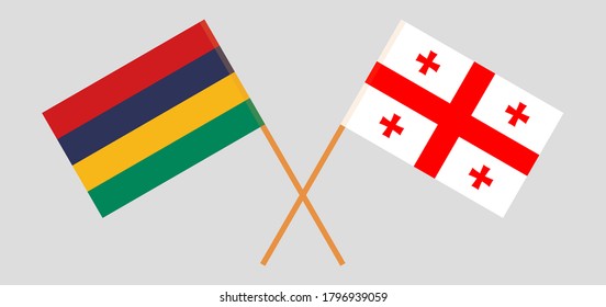 Crossed flags of Mauritius and Georgia
