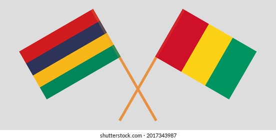 Banderas cruzadas de Mauricio y Guinea. Colores oficiales. Proporción correcta