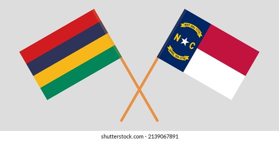 Crossed flags of Mauritius and The State of North Carolina. Official colors. Correct proportion. Vector illustration
