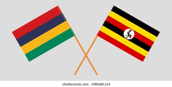 Crossed flags of Mauritius and Uganda. Official colors. Correct proportion