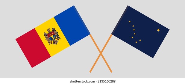 Crossed flags of Moldova and the State of Alaska. Official colors. Correct proportion. Vector illustration

