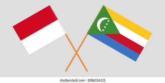 Crossed flags of Monaco and the Comoros. Official colors. Correct proportion. Vector illustration
