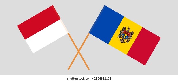 Crossed flags of Monaco and Moldova. Official colors. Correct proportion. Vector illustration
