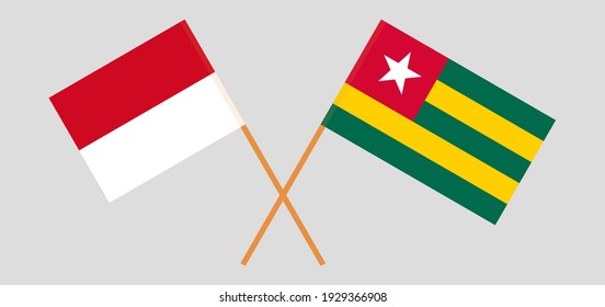 Crossed flags of Monaco and Togo. Official colors. Correct proportion