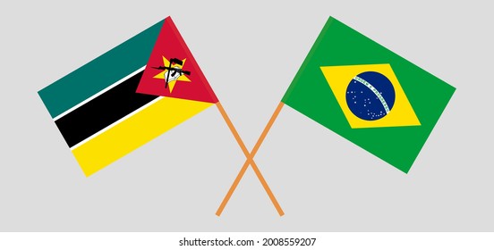 Crossed flags of Mozambique and Brazil. Official colors. Correct proportion
